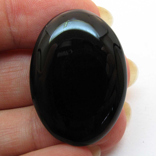 Kabošon černý onyx ovál 33mm — foto 1