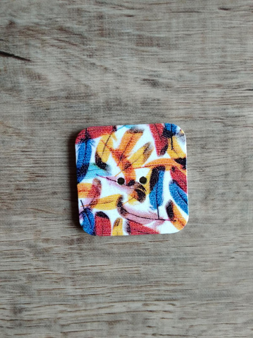 Knoflíček s pírky — foto 1