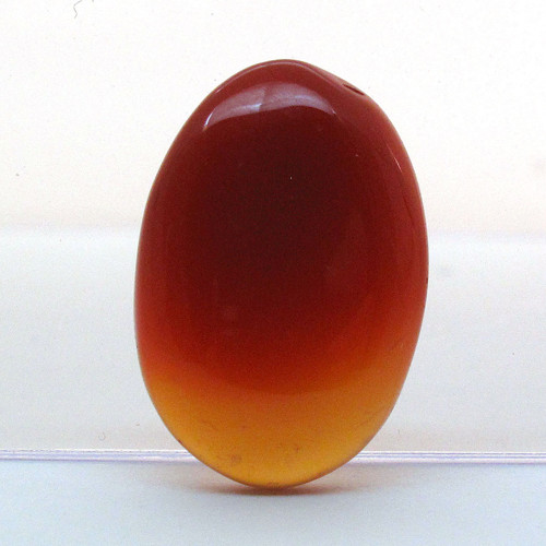Kabošon oranžový onyx ovál 19,6mm