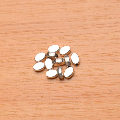 Oválek - stříbro - 6x4mm — foto 1
