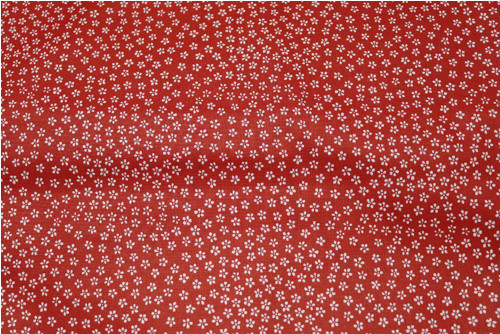 Bílá kytička na červené