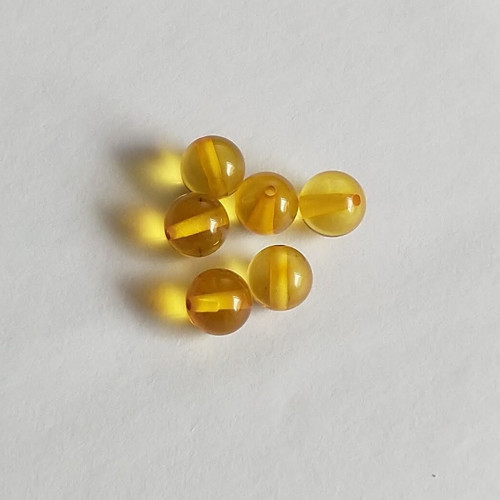Jantar 24 korálky 7 mm, 1 kus