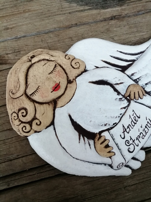 Andílek letící , reliéf — foto 1