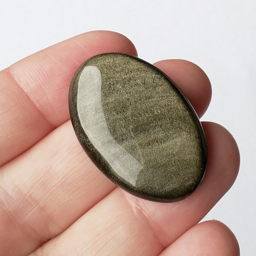 Obsidián zlatý 51 kabošon 33 x 22 x 6 mm