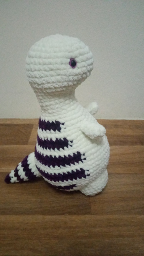 Háčkovaný dinosaurus