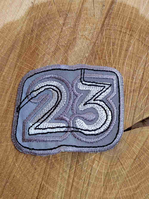 Nažehlovačka reflexní čísla 23