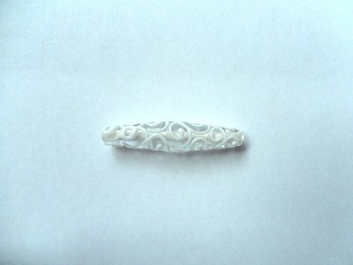 Špulka s ornamenty — foto 1