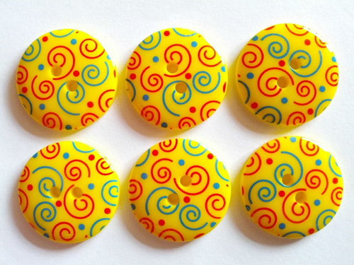 Knoflík 23 mm SPIRÁLA ŽLUTÁ