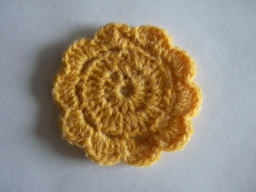 Brož, aplikace, sluníčko — foto 1