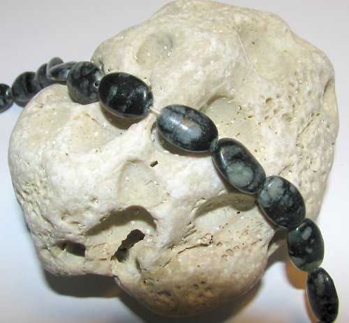 J156 Jaspis picasso - černý ovál 12 x 8 mm