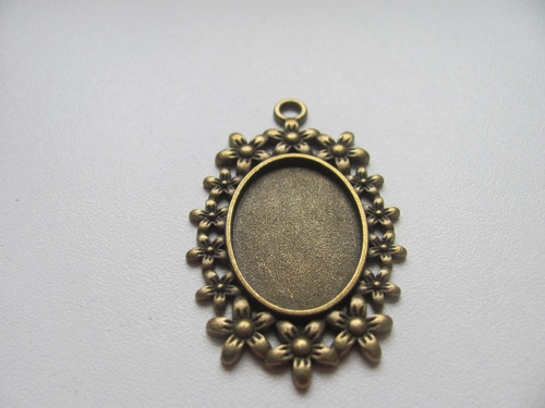 Kovové lůžko bronz oválné - 18x25 mm