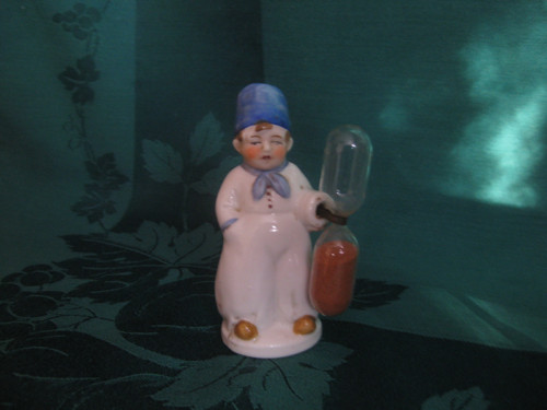 Porcelánová figurka-přesýpací hodiny — foto 1