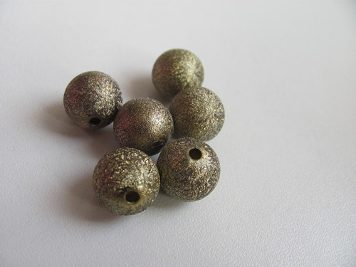 STARDUST korálek 12 mm tmavší zlatá