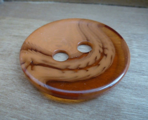 Velký oranžový knoflík