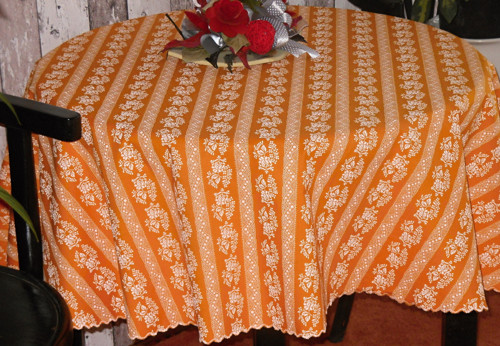 Kulatý ubrus oranž.s bílým krajk. vzorem-pr150