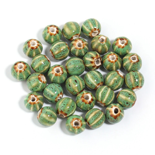 Keramický korálek pruhovaný zelený 10mm, 2ks