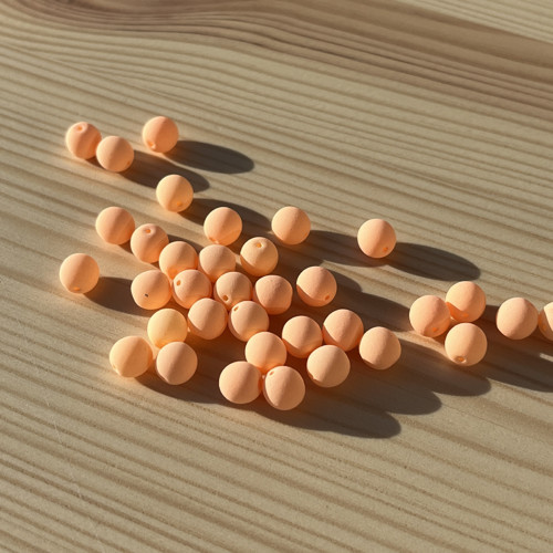 Korálky UV; 6 mm - pastelově oranžové