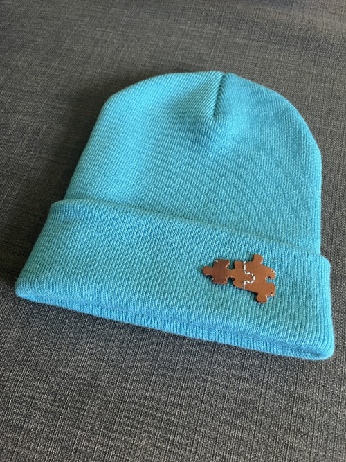 Teplá čepice s puzzlíkem