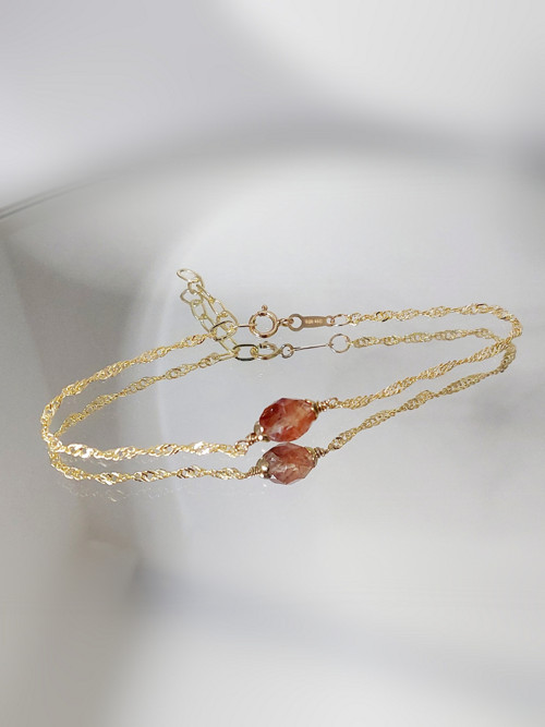"REA"náramek GOLD FILLED 1/20 14Kt, červ. křišťál