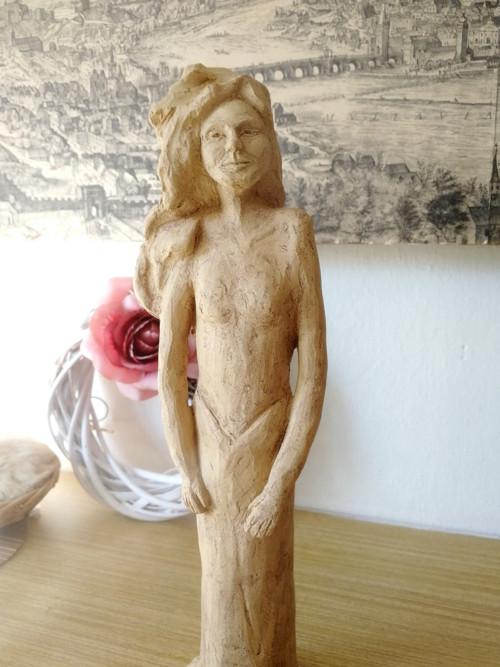 Žena