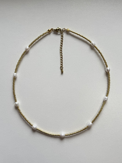 Golden necklace with pearls