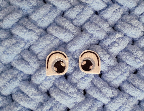 Vyšívané oči 2x2,5 cm sv. modré s jiskrou 1 pár
