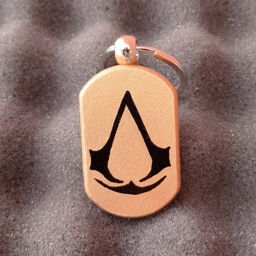 Assassins Creed - měděná klíčenka