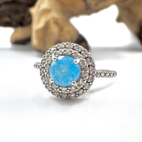 Stříbrný prsten se zirkony a modrý diamant .Ag 925