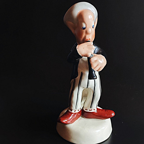 Porcelánová figurka klarinetista