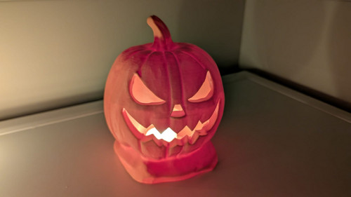 Svítící halloweenská dýně s LED svíčkou