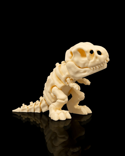 3D tištěná dekorativní figurka kostry T-Rexe.