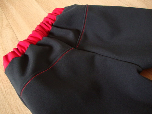 Rostoucí softshellové kalhoty černo - červené — foto 5