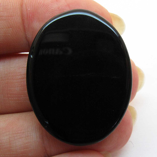Kabošon černý onyx ovál 33mm — foto 2