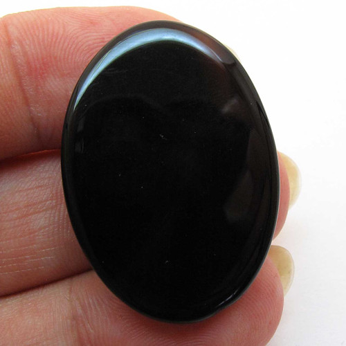 Kabošon černý onyx ovál 33mm — foto 2