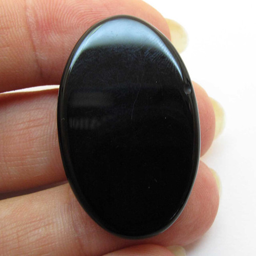 Kabošon černý onyx ovál 33mm — foto 2