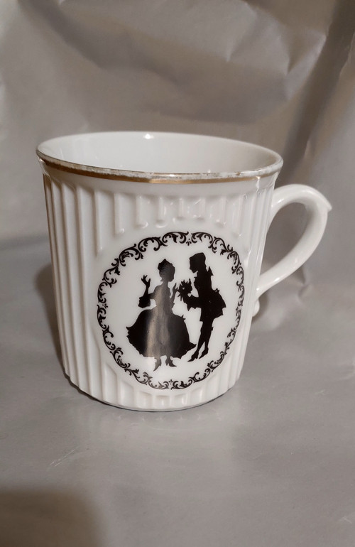 Starý porcelánový hrneček — foto 5