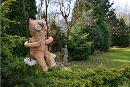 Kocour na houpačce — foto 2